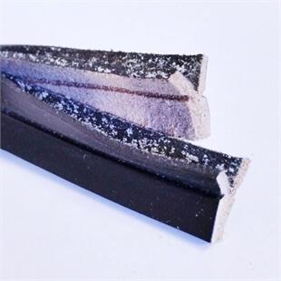 Close up photo of black welting with a white background